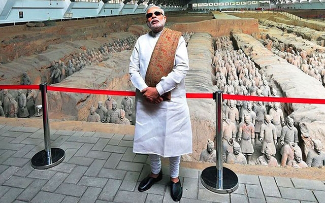 Narendra Modi in Teracota museum in black goggle and shawl