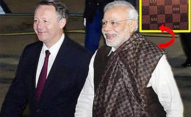 Narendra Modi in a shawl with his name weaved on it